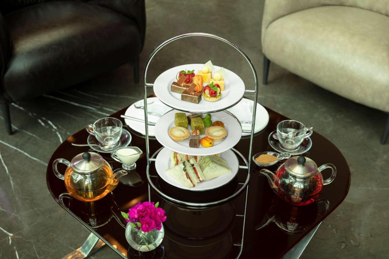 Radisson Blu Atria Bengaluru Hotel Екстериор снимка Afternoon tea at the InterContinental Hotel, London